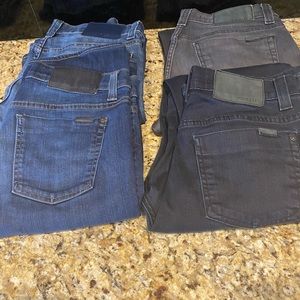 Collection of men’s fidelity jeans and pants.